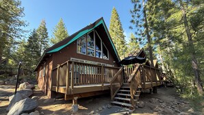 A cabin with a wooden deck and a staircase leading to a porch. - Tahoe Time Cabin w/King Bed, Modern Tahoe Cabin w/ King Bed Suite & Level 1 EV Charging (Incline Village)