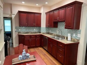 Oven, paper towels, dining tables