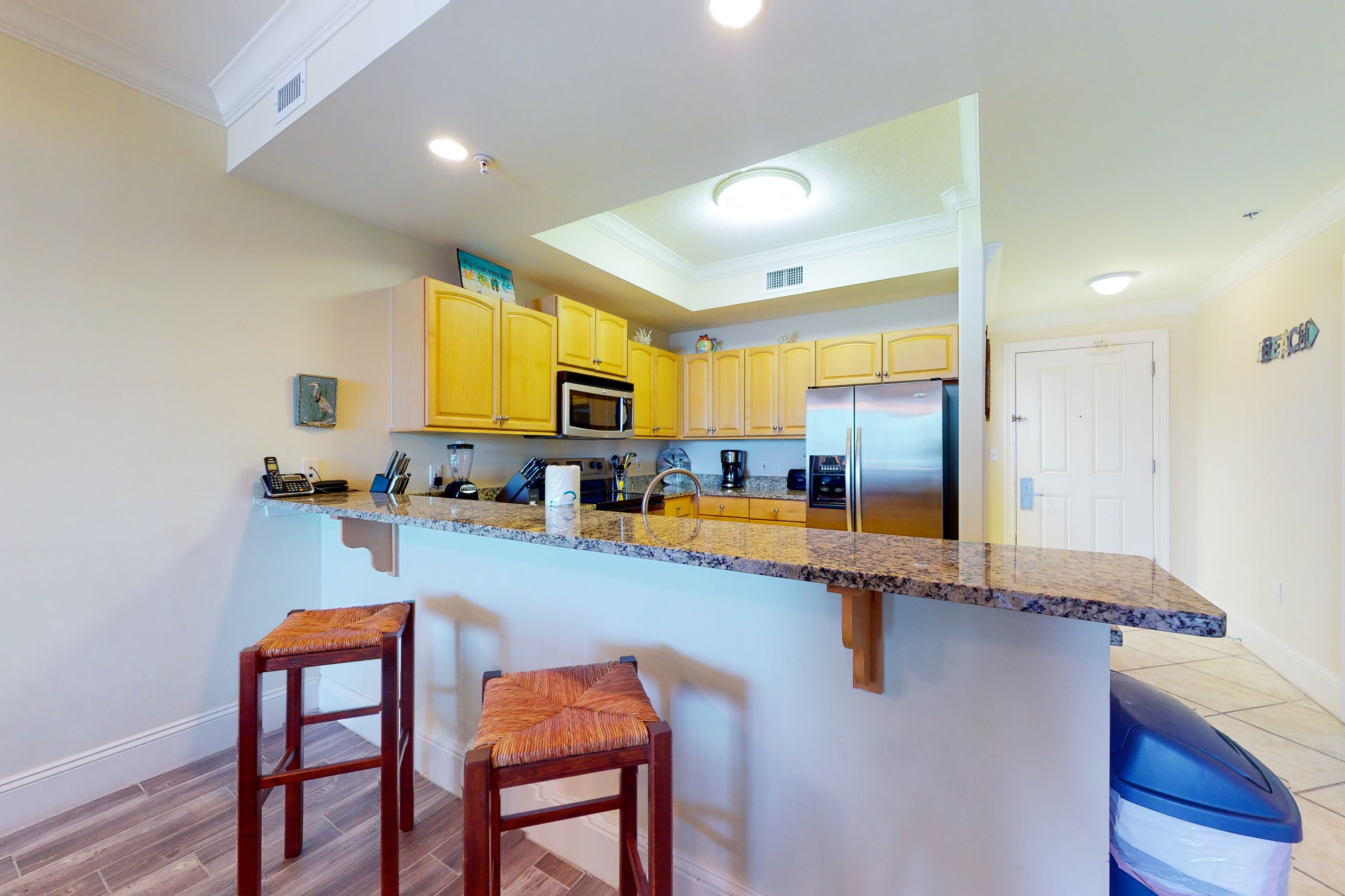 Beachfront condo with pool, hot tub, W/D, sauna, balcony, and tennis court