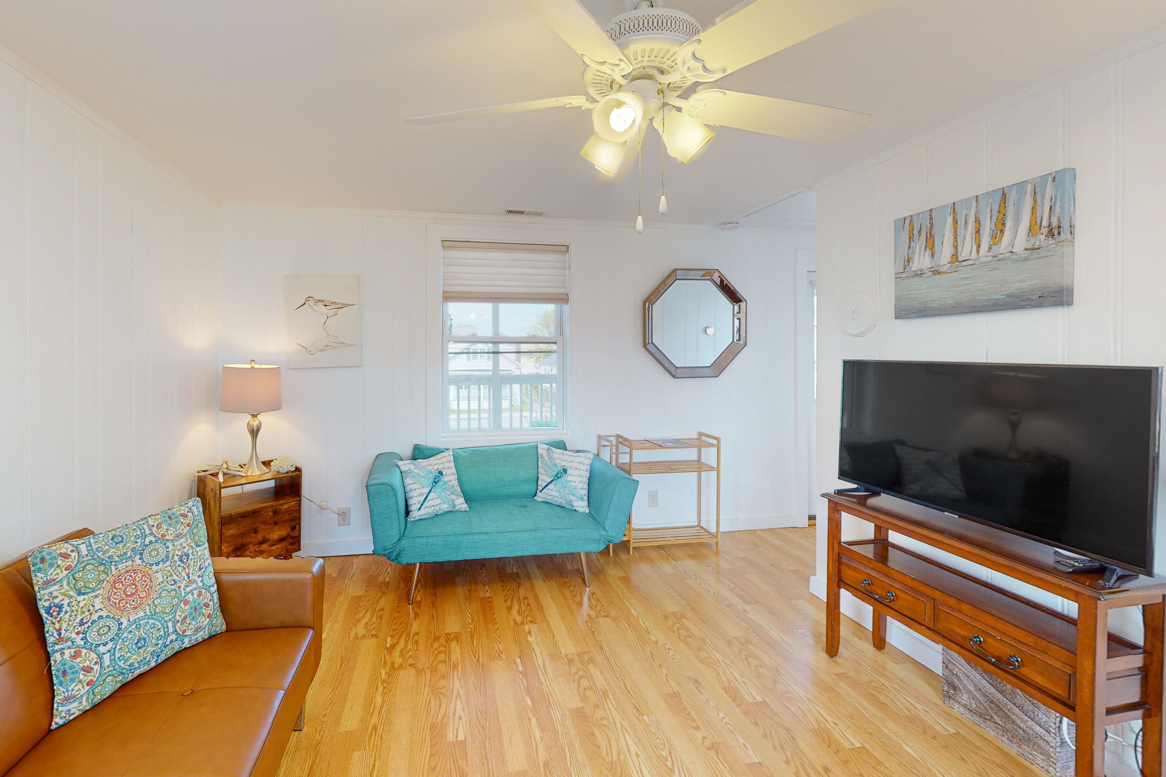 Inviting condo near the beach with balcony, central AC, & full kitchen