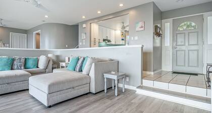 Two-story ocean view home with a furnished patio & deck, washer/dryer, & AC