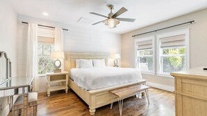A bedroom with a bed, bedside tables, a bench, a desk, and a chair. - Walk to Beach & Dining, Luxury Home in Seagrove, Private Pool, Sleeps 14, Bikes (Santa Rosa Beach)