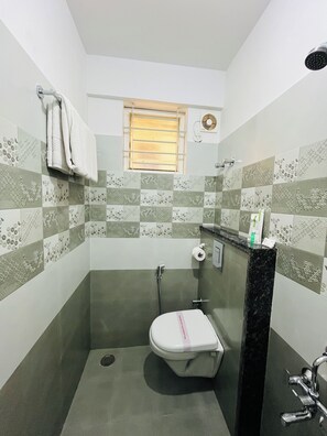 Shower, rainfall showerhead, towels, soap - VALUE INN (Bengaluru)