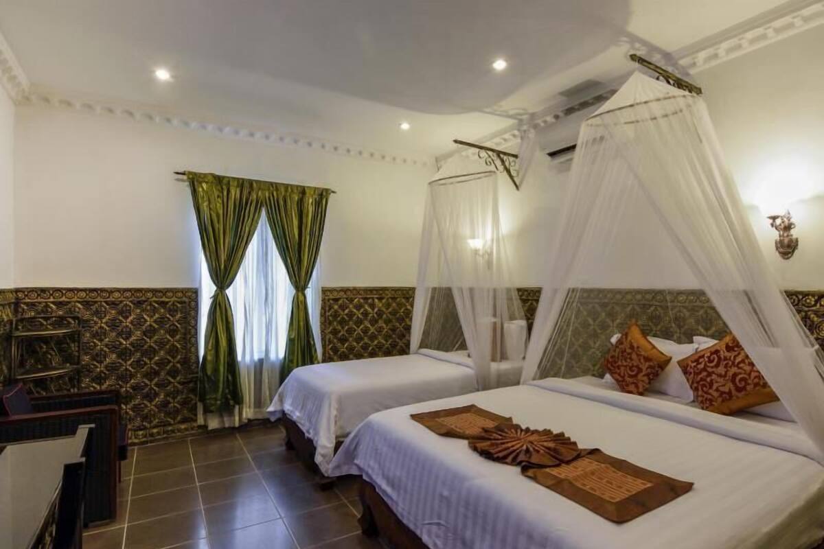 Premium bedding, desk, laptop workspace, blackout curtains