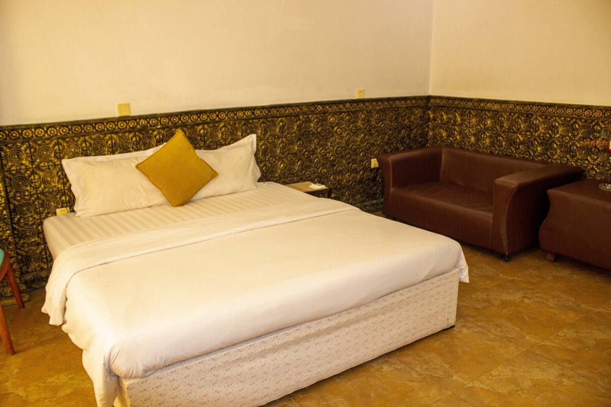 Premium bedding, desk, laptop workspace, blackout curtains