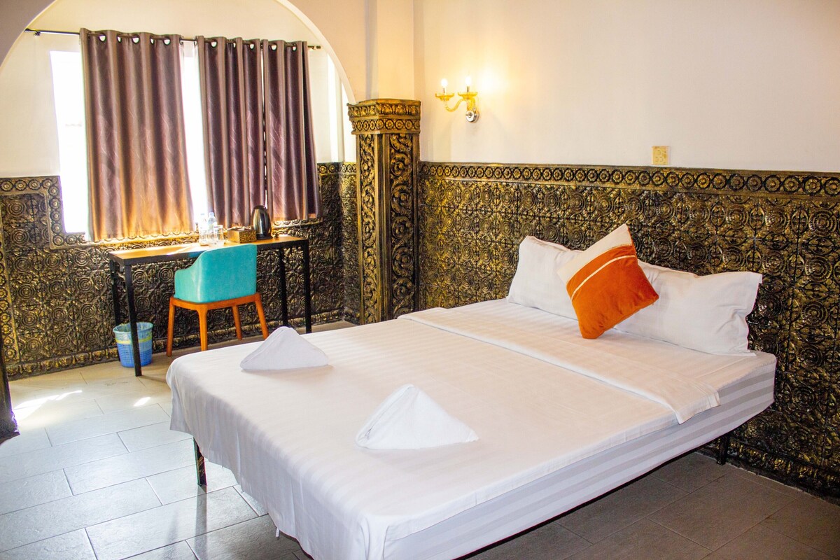 Premium bedding, desk, laptop workspace, blackout drapes