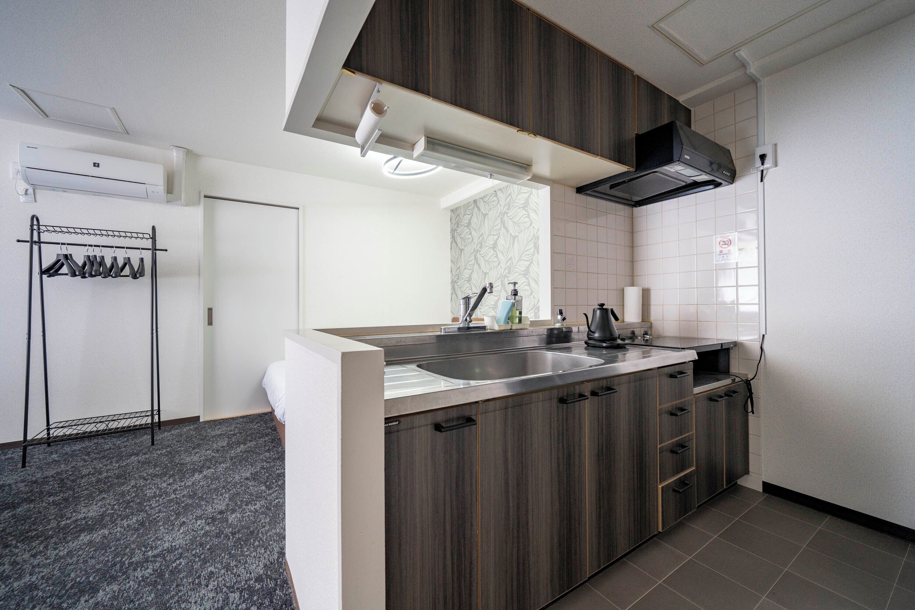 Deluxe Suite | Private kitchen | Fridge, microwave, stovetop, toaster