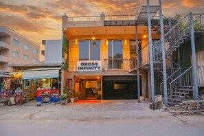 A two-story building with a sign reading "GROSS INFINITY". - FabHotel Delta Suites I (New Delhi)