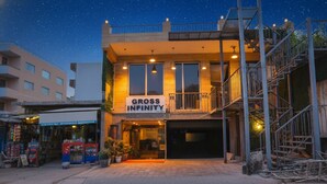 A building with a sign reading "GROSS INFINITY" and a visible entrance. - FabHotel Delta Suites I (New Delhi)