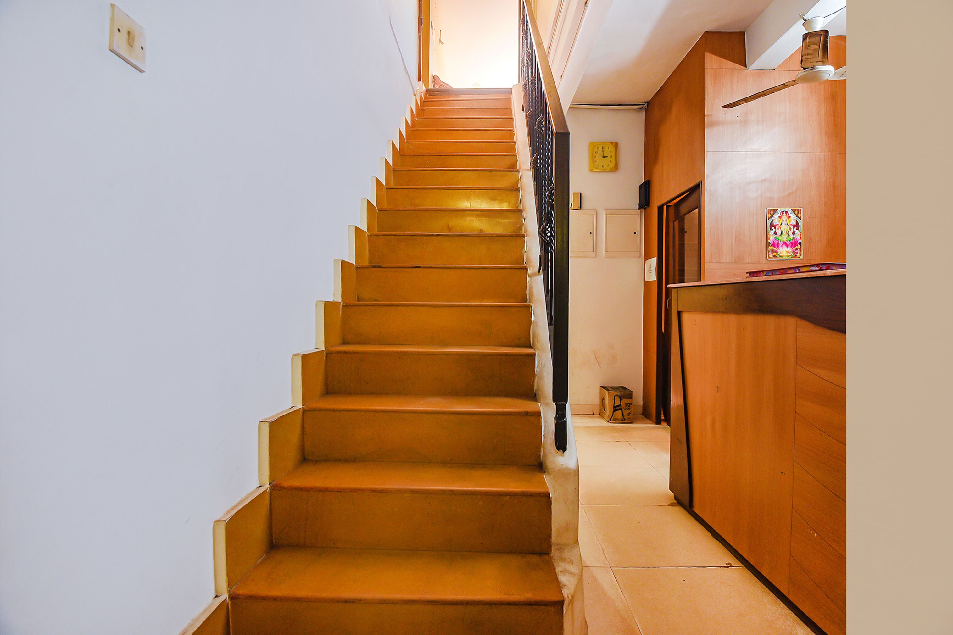 A staircase with wooden steps leading to a landing.