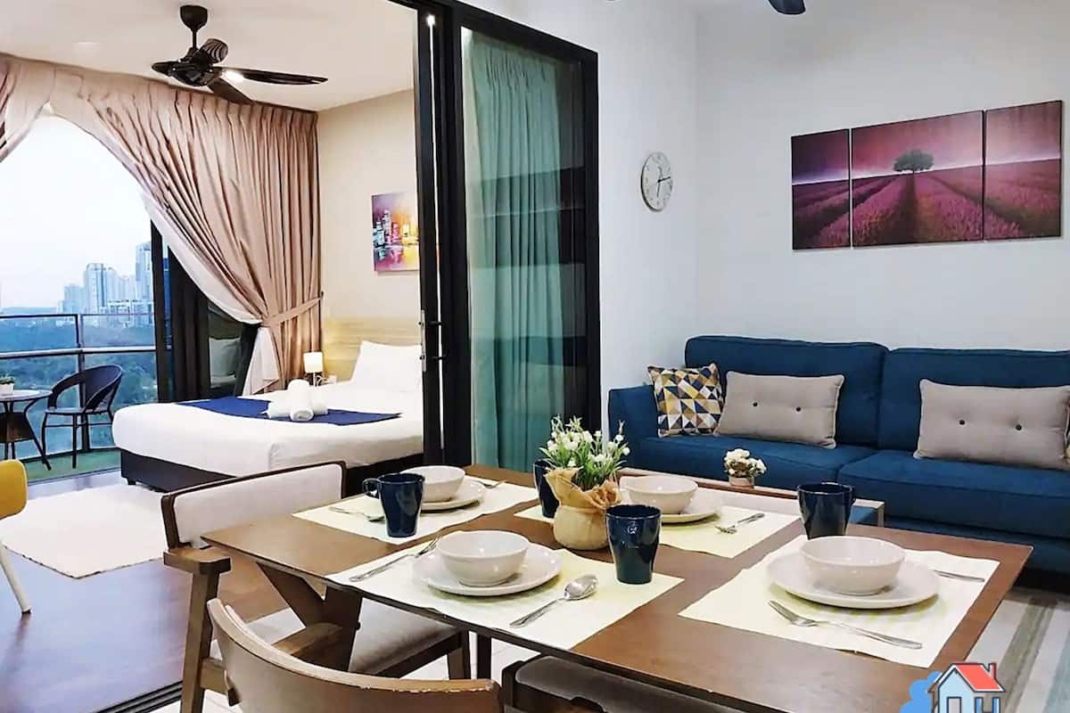 A modern hotel room with a balcony, a dining area, and a living space.
