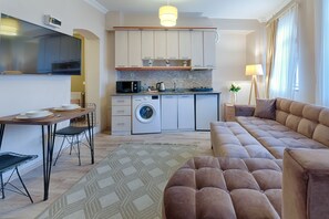 Standard Apartment I | Living area | 55-inch Smart TV with digital channels, TV