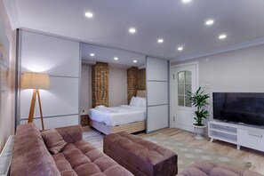 Standard Apartment II | Living area | 55-inch Smart TV with digital channels, TV