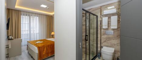 Standard Single Room | Bathroom | Shower, rainfall showerhead, hair dryer, slippers