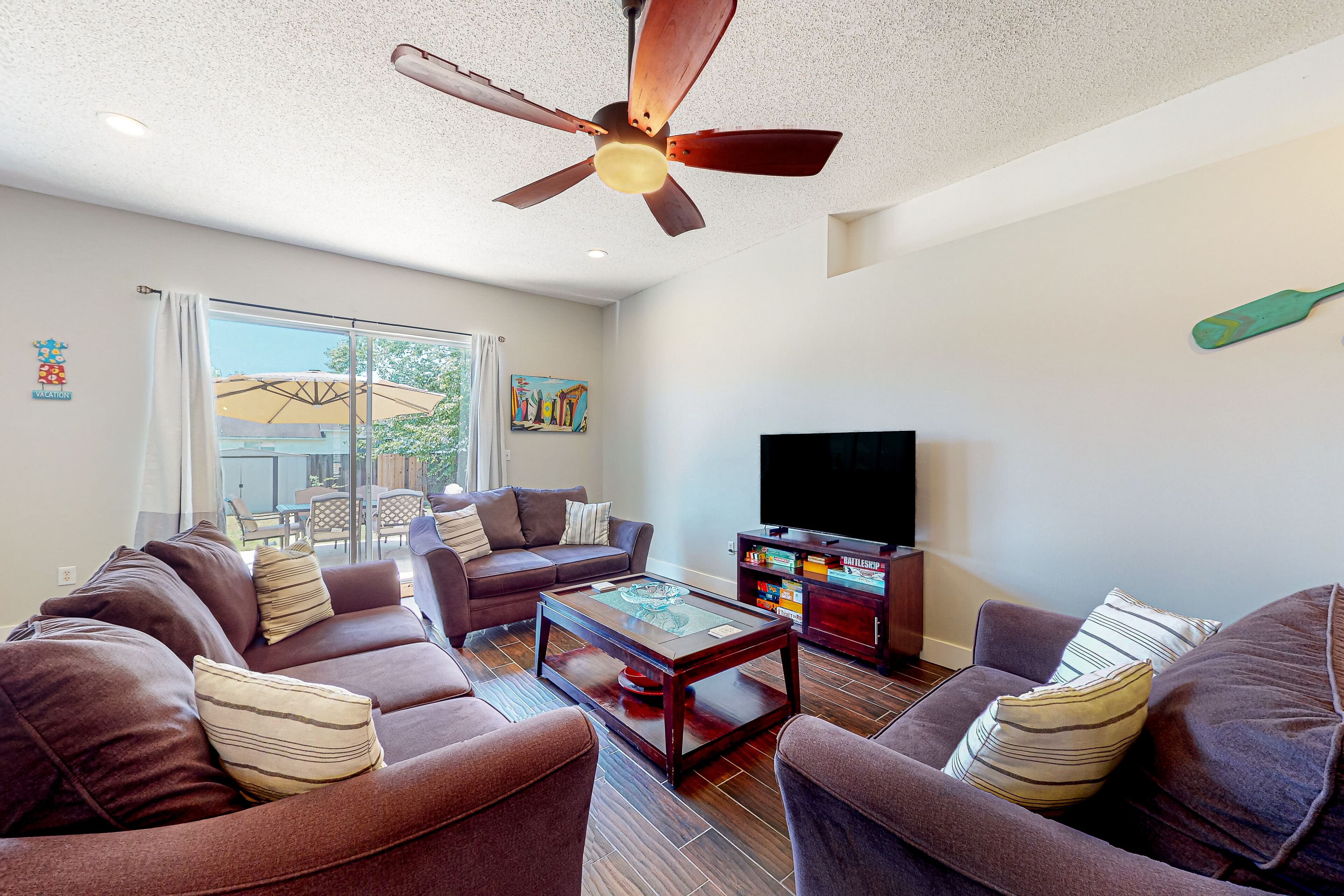 Sunny home near the beach with patio, grill, washer/dryer, central AC, & WiFi