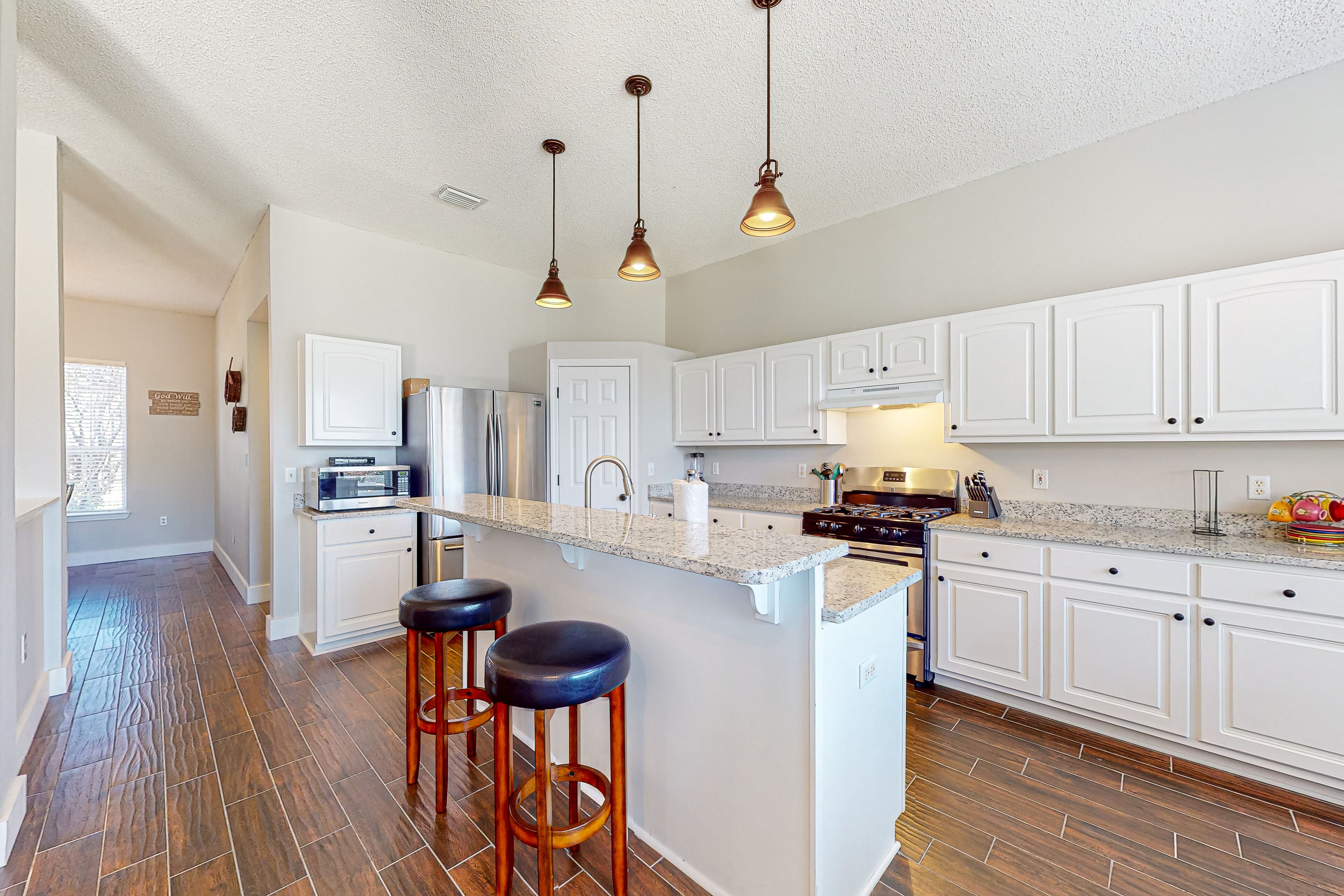 Sunny home near the beach with patio, grill, washer/dryer, central AC, & WiFi