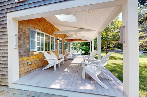 Tree-lined home with lovely yard, decks & private beach access - walk to town