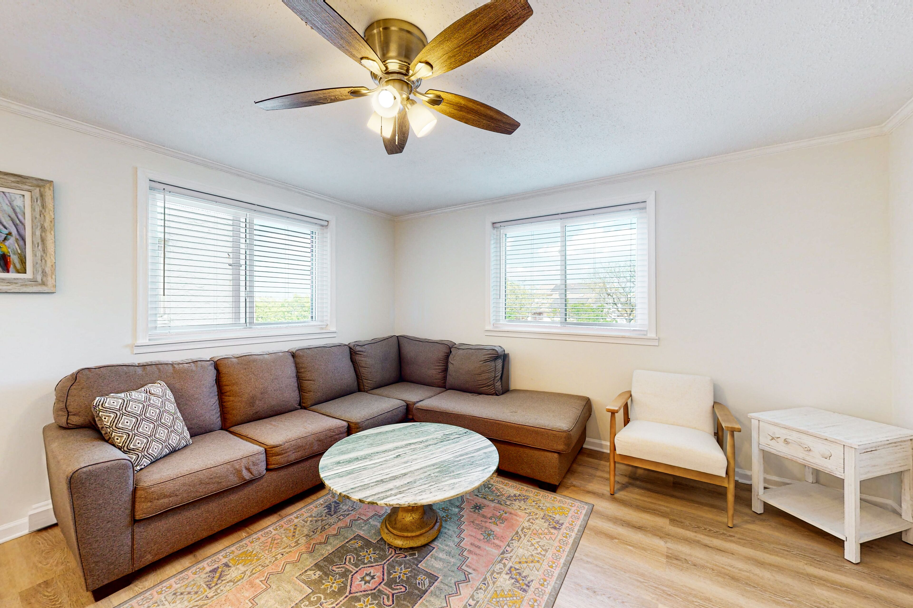 Updated condo with covered balcony, central AC, & washer/dryer