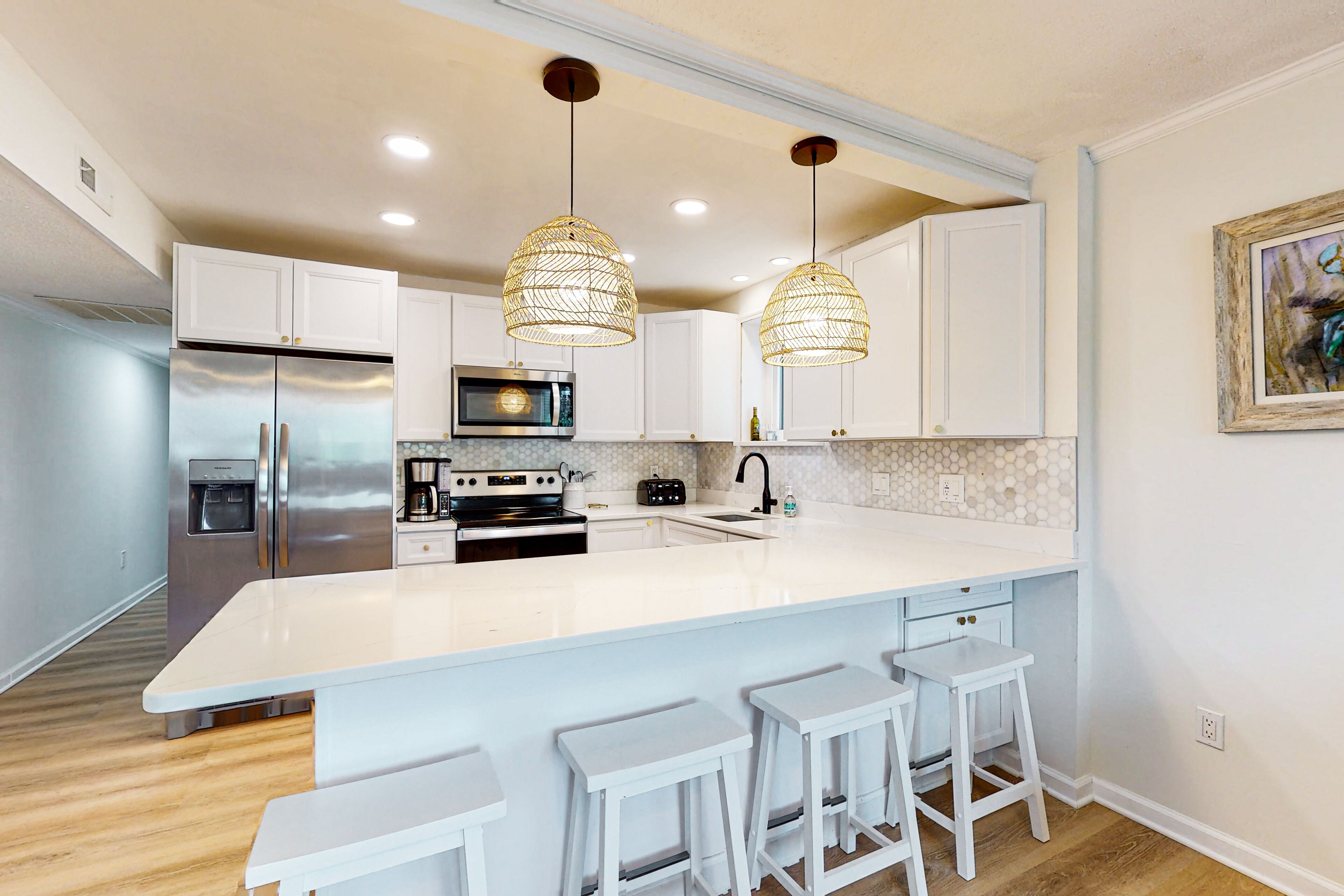 Updated condo with covered balcony, central AC, & washer/dryer