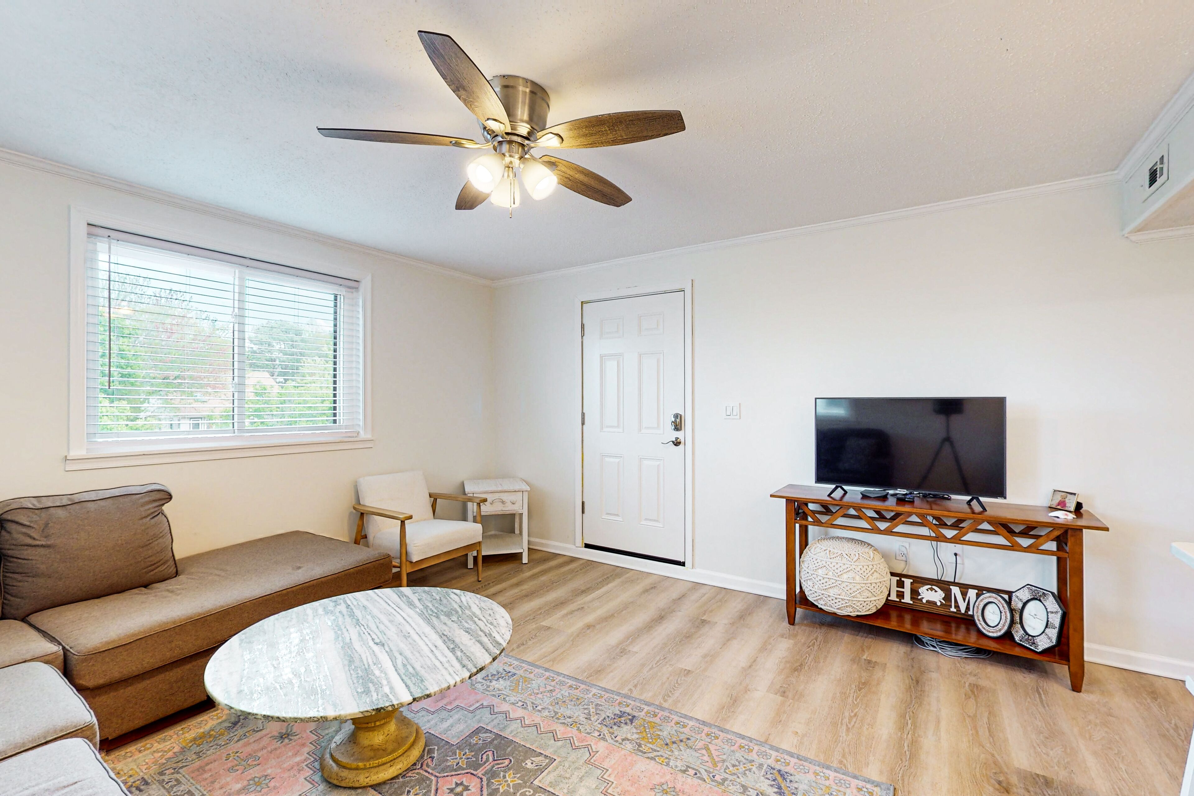 Updated condo with covered balcony, central AC, & washer/dryer