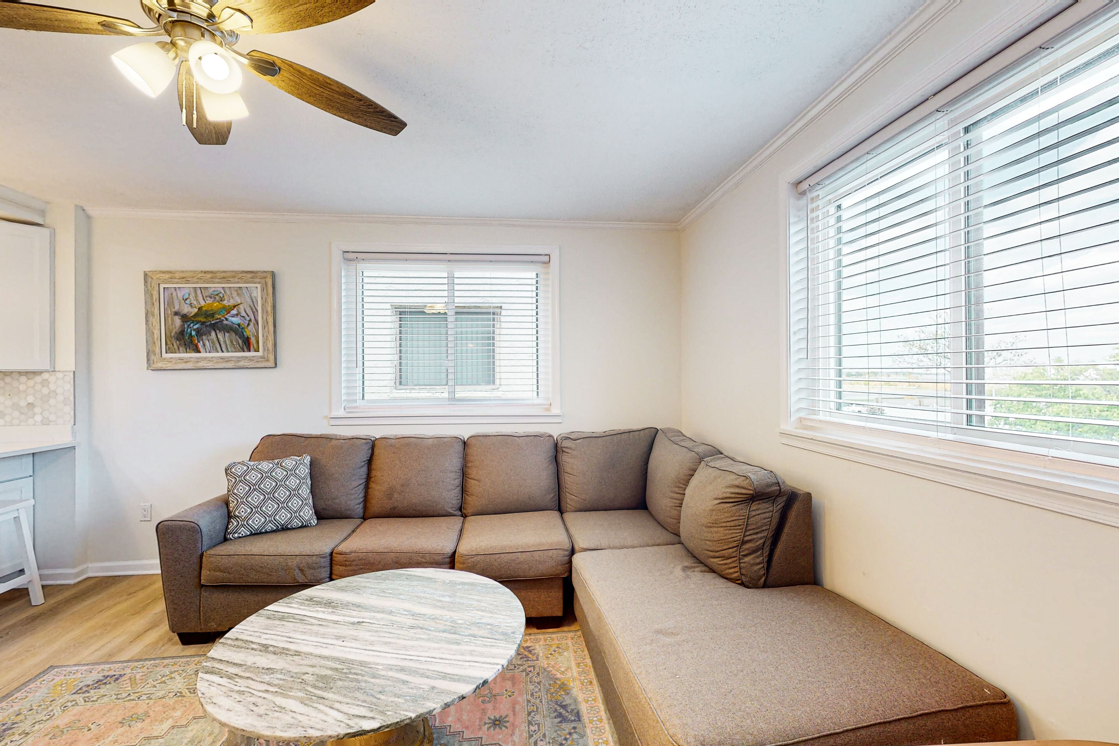 Updated condo with covered balcony, central AC, & washer/dryer