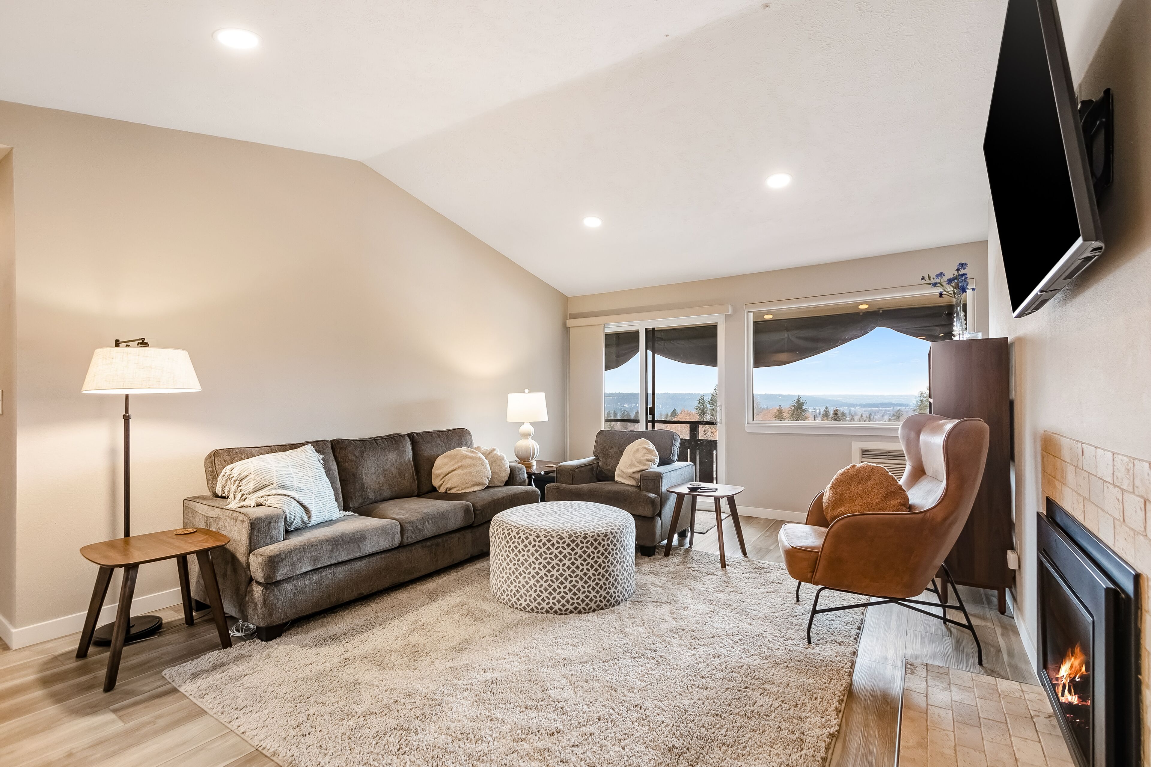 Centrally located apartment with spectacular views, a gas fireplace, W/D, & AC