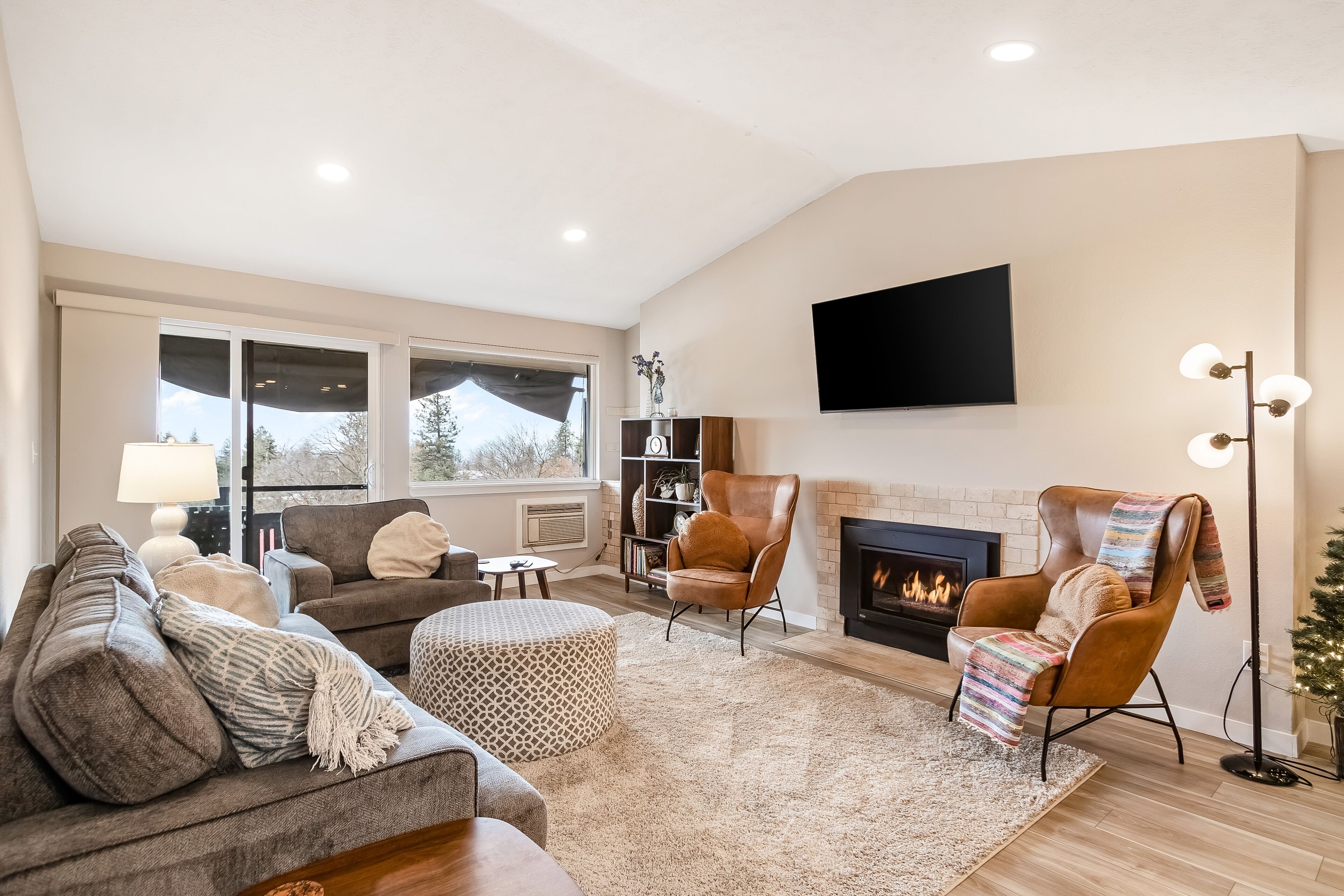 Centrally located apartment with spectacular views, a gas fireplace, W/D, & AC