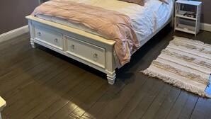 A bedroom with a bed, a ceiling fan, a window with blinds, a nightstand, and a walk-in closet. - Townhouse in Old Fishtown! 10 mins to Center City & Stadiums (Philadelphia)