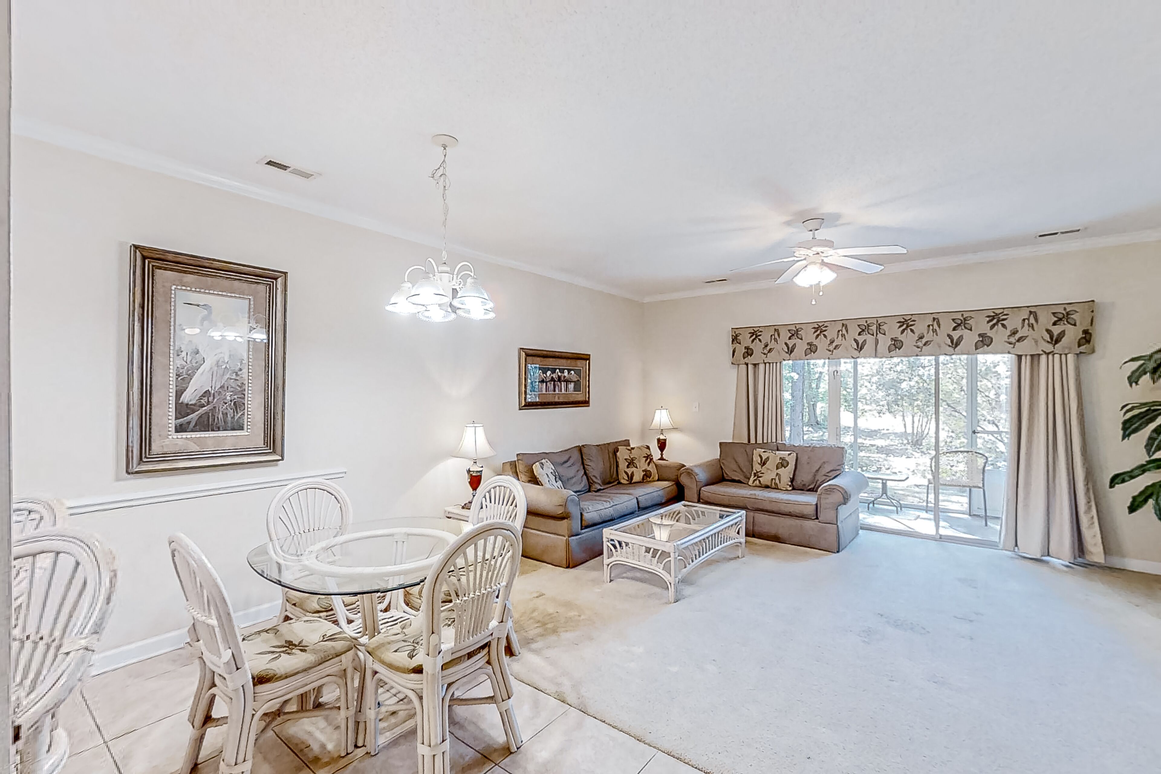 Dog-friendly lake-view ground-floor condo with screened patio, W/D, & pool