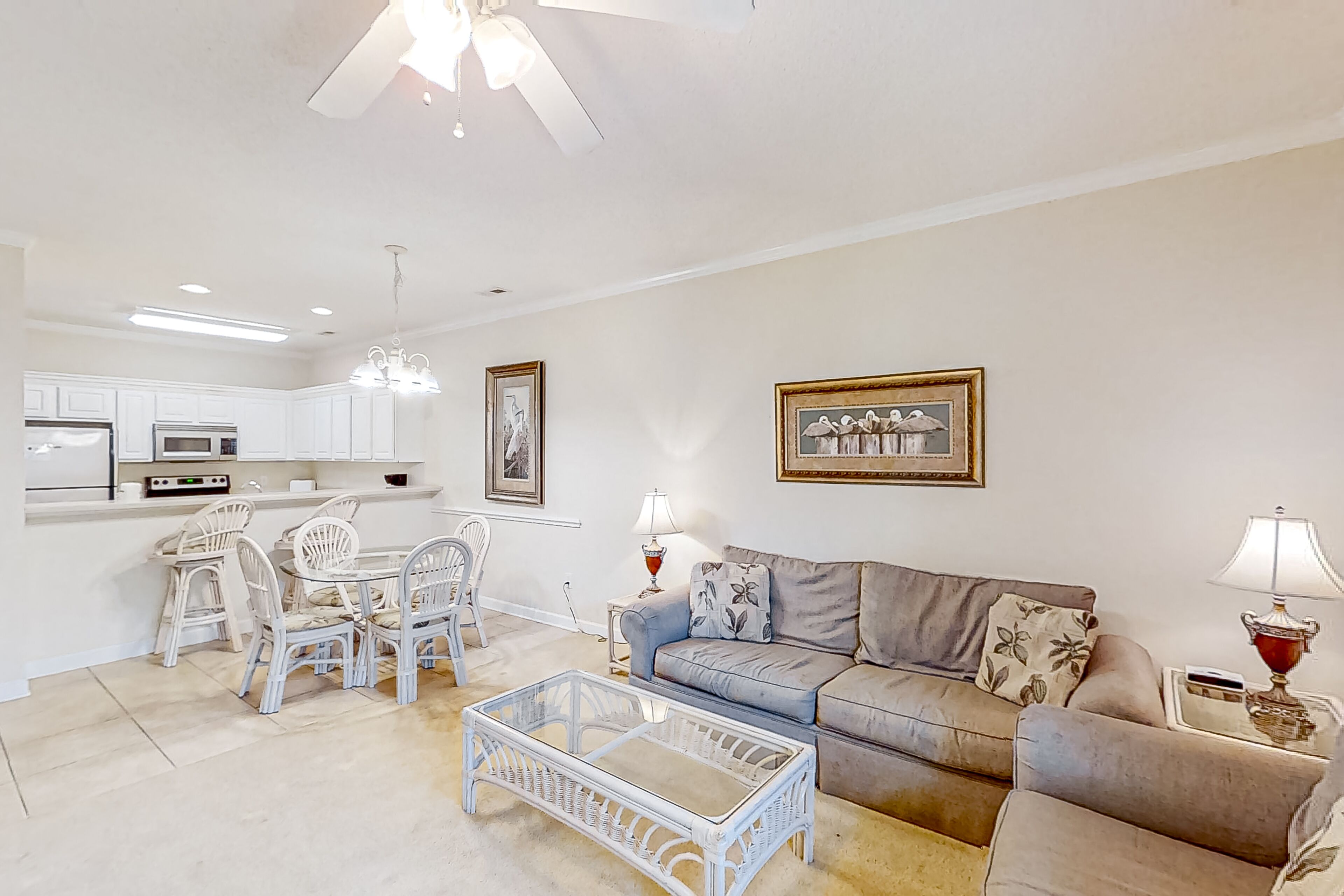 Dog-friendly lake-view ground-floor condo with screened patio, W/D, & pool