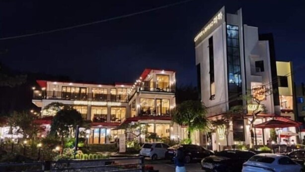 A multi-story hotel with a modern design, featuring balconies and large windows. - Daejeon Bedroom 3, Bathroom 2, Spacious Living Room Free Parking (Pasay)