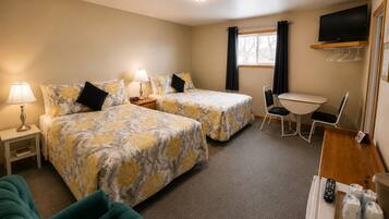 Deluxe Quadruple Room, 2 Queen Beds | Individually decorated, individually furnished, desk, laptop workspace