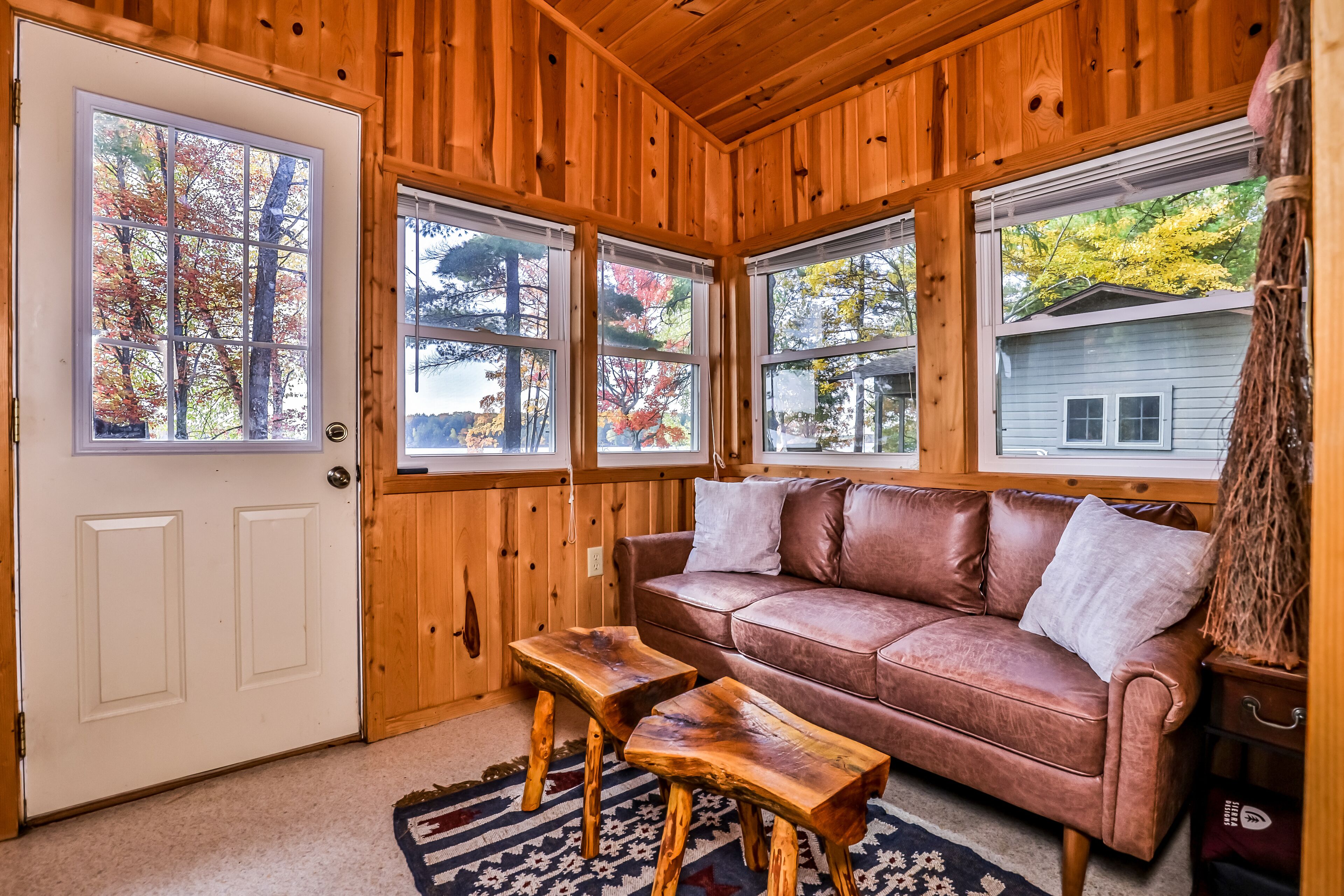 Charming, dog-friendly, lakefront cottage with boat dock, grill, & firepit