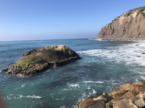 A rocky coastline with clear blue water and a cliff. - Summer Special at Monarch Beach, Dana Point (Dana Point)