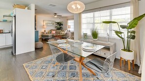 A modern kitchen with a dining area. - 4 Mi to Siesta Key Beach: Sunny Home w/ Hot Tub! (Sarasota)