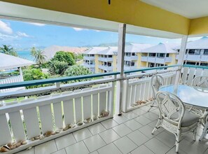 Outdoor dining - Dante's Paradise awaits YOU 2 bed, 2 bath condo, steps from the pool and beach! (Christiansted)