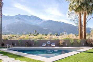 Triangular pool with mountain views