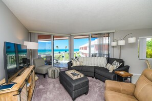 TV, books - Peaceful Escape with Beach Facing Balcony and Pool! (Bradenton Beach)