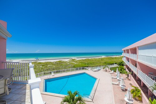 Peaceful Escape with Beach Facing Balcony and Pool!