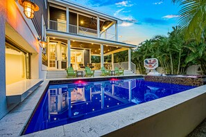 A heated pool - Beautiful New Home! Outdoor Pool Area with Swim up bar (Holmes Beach)