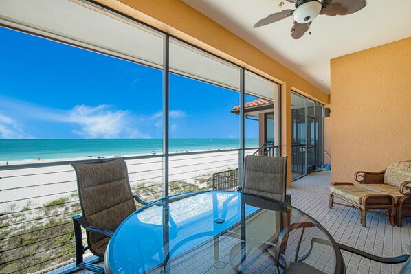 Outdoor dining - Stunning Beachfront Condo with Pools, Direct Beach Access and Views! (Bradenton Beach)