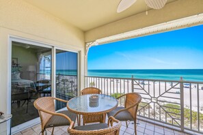 Outdoor dining - Direct Beachfront Condo! Private Balcony, Amazing Views! Community Pool (Bradenton Beach)