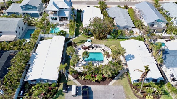 Stunning homes surrounded by lush greenery and a serene pool area.