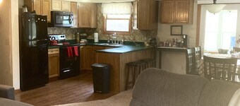 Roomy home with spacious fenced in backyard and fire pit.