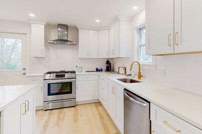 Coastal retreat steps to the beach with smart TVs, desk, grill, children's items