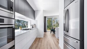 Fridge, stovetop, dishwasher, coffee/tea maker