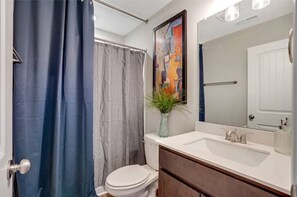Shower, hair dryer, towels, toilet paper