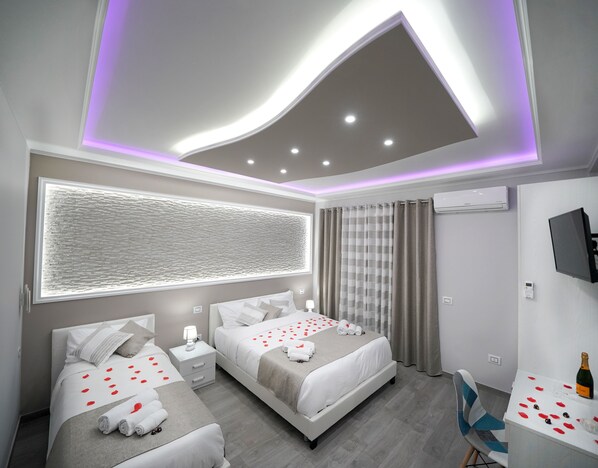 1 habitación, ropa de cama de alta calidad, cubrecamas y minibar 