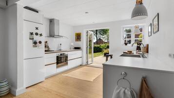 Fridge, stovetop, dishwasher, coffee/tea maker