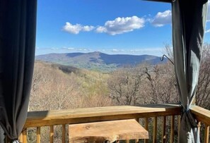 Enjoy breathtaking views of the surrounding mountains from this deck.
